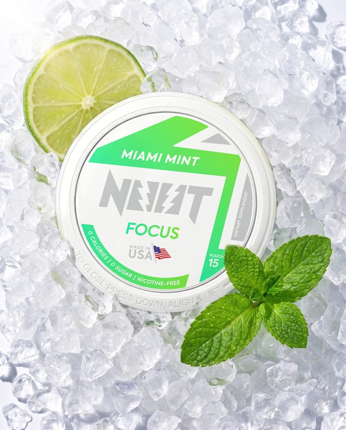 Miami Mint tin with mint leaves, ice and citrus